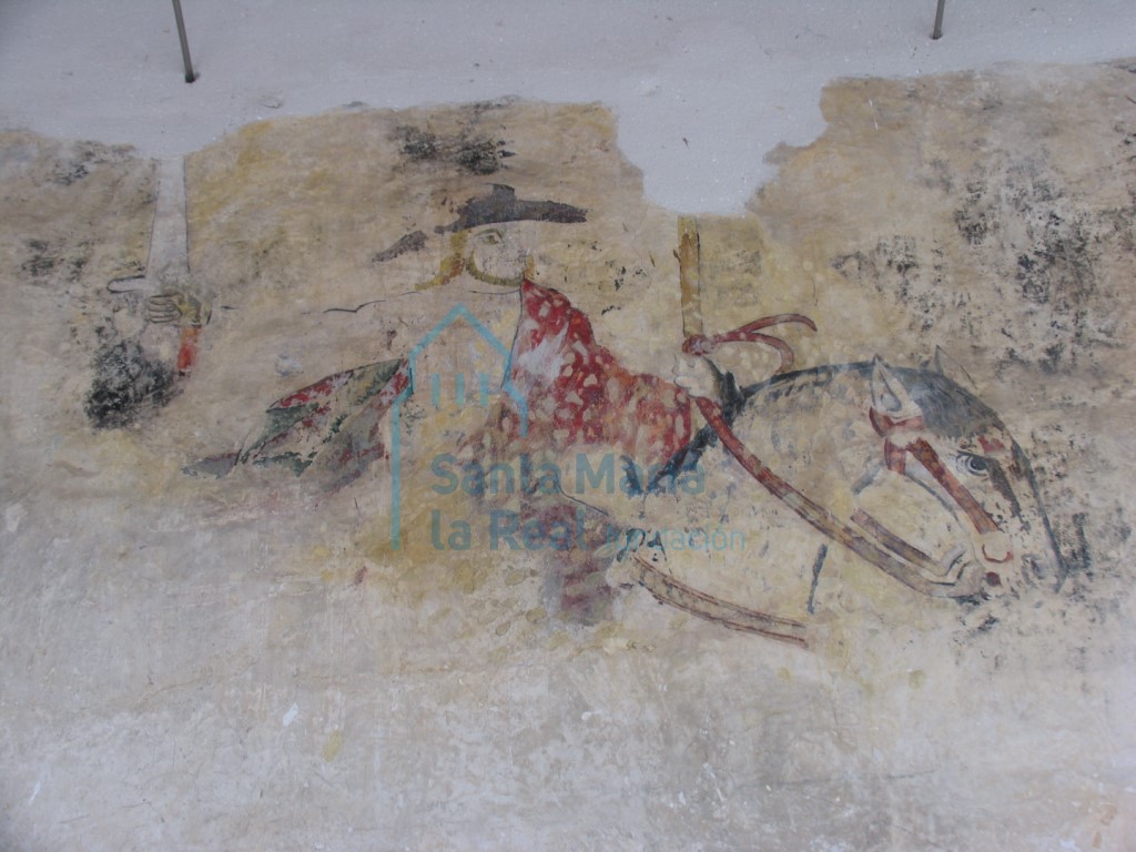 Restos de pintura mural gótica, la imagen de un jinete, en el muro norte de la nave