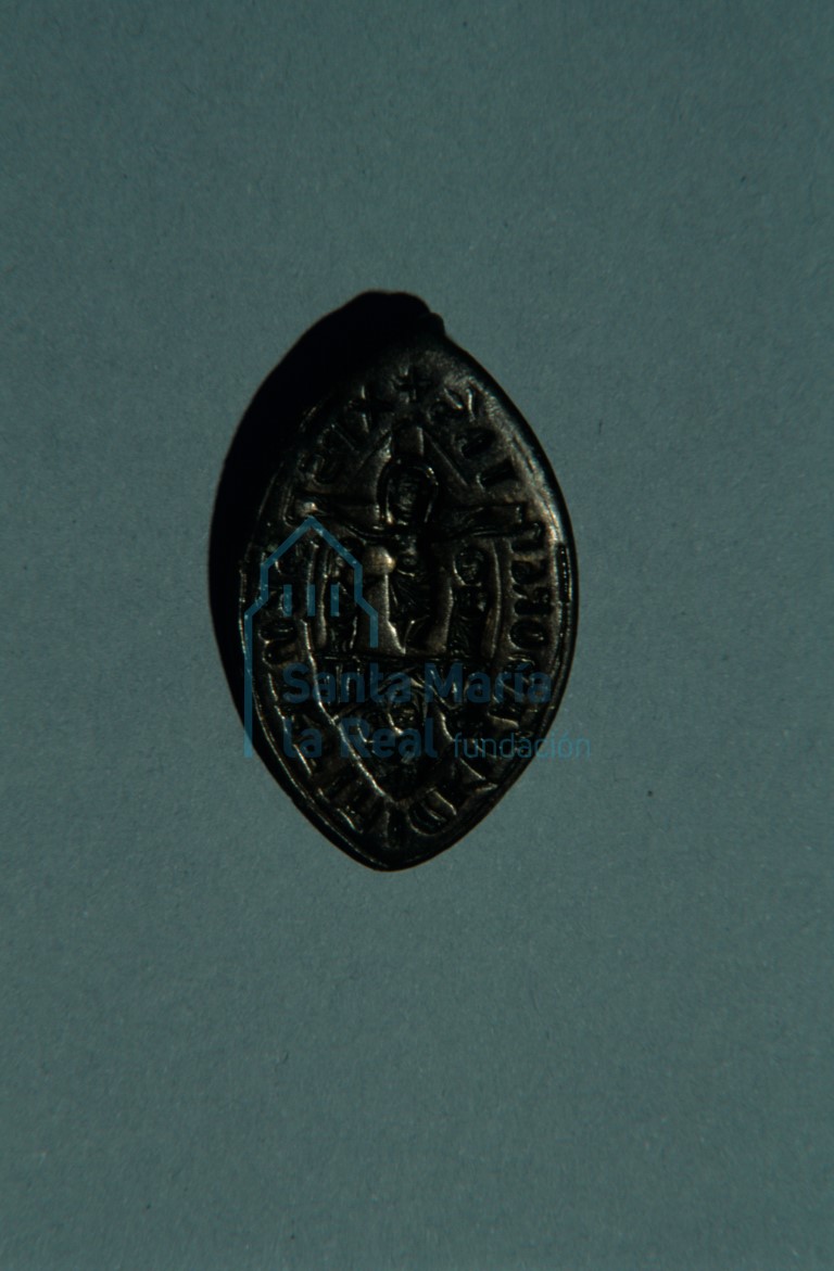 Matriz de un sello, con la imagen de Cristo crucificado con María y Juan a los pies